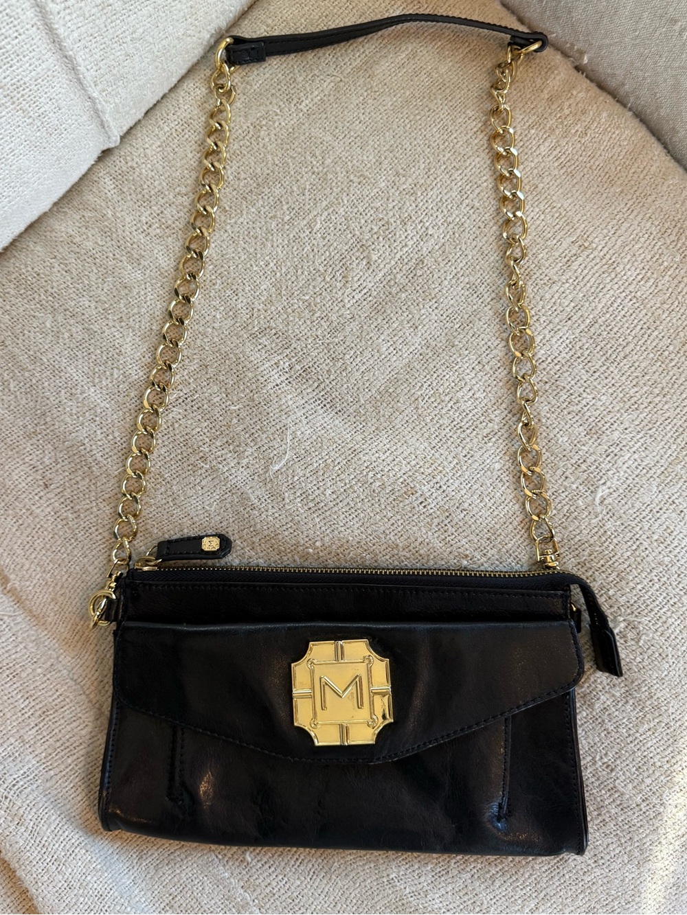 Monet Black Crossbody Bag with Gold Chain and Emblem